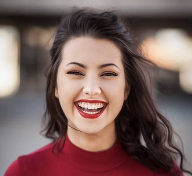 Laughing woman red sweater