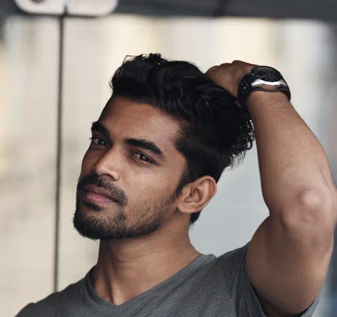 Man touching styled hair